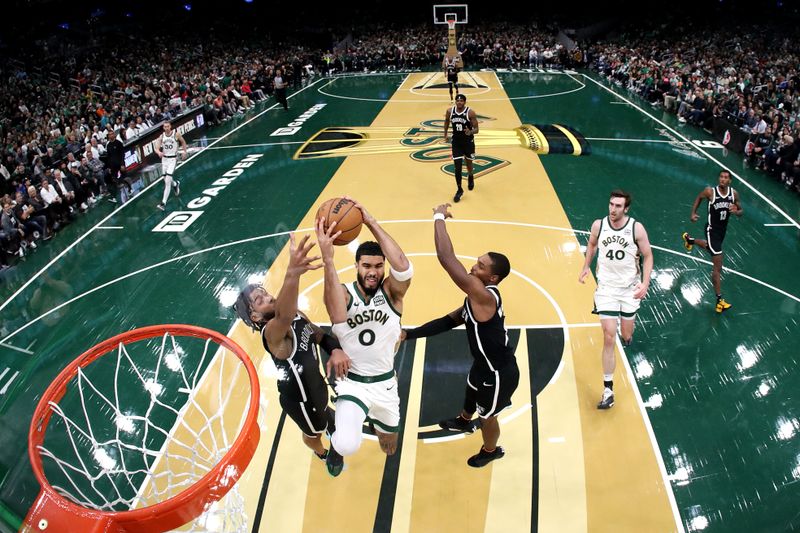 BOSTON, MASSACHUSETTS - NOVEMBER 10: Jayson Tatum #0 of the Boston Celtics takes a shot between Trendon Watford #9 and Lonnie Walker IV #8 of the Brooklyn Nets during the second hafl of their In-Season Tournament game at TD Garden on November 10, 2023 in Boston, Massachusetts. The Celtics defeat the Nets 121-107. NOTE TO USER: User expressly acknowledges and agrees that, by downloading and or using this photograph, User is consenting to the terms and conditions of the Getty Images License Agreement. (Photo by Maddie Meyer/Getty Images)