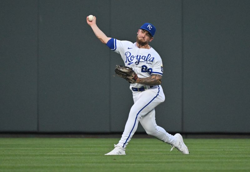 Jul 15, 2023; Kansas City, Missouri, USA;  Kansas City Royals center fielder Kyle Isbel (28) throws the ball to the infield against the Tampa Bay Rays in the ninth inning at Kauffman Stadium. Mandatory Credit: Peter Aiken-USA TODAY Sports