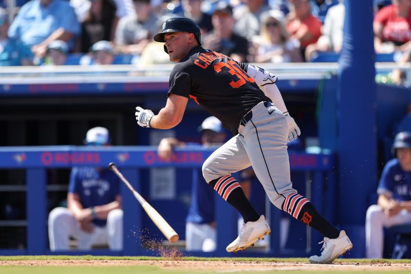 Feb 28, 2025; Dunedin, Florida, USA; Detroit Tigers outfielder Kerry Carpenter (30) hits a base hit against the Toronto Blue Jays in the second inning during spring training at TD Ballpark. Mandatory Credit: Nathan Ray Seebeck-Imagn Images