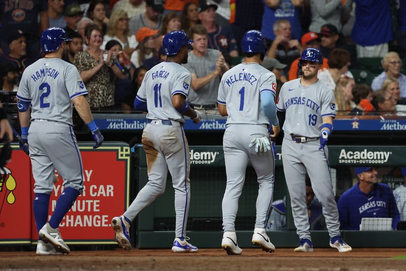 Aug 29, 2024; Houston, Texas, USA; Kansas City Royals second baseman Michael Massey (19) celebrates left fielder MJ Melendez (1) and  third baseman Maikel Garcia (11) scoring agains the Houston Astros in the seventh inning at Minute Maid Park. Mandatory Credit: Thomas Shea-USA TODAY Sports