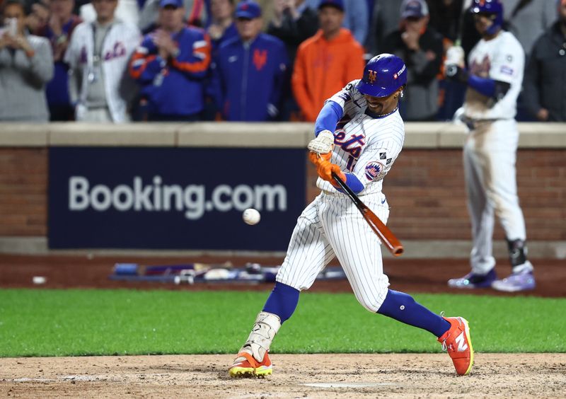 Oct 9, 2024; New York, New York, USA;  New York Mets shortstop Francisco Lindor (12) hits a grand slam against the Philadelphia Phillies in the sixth inning in game four of the NLDS for the 2024 MLB Playoffs at Citi Field. Mandatory Credit: Wendell Cruz-Imagn Images