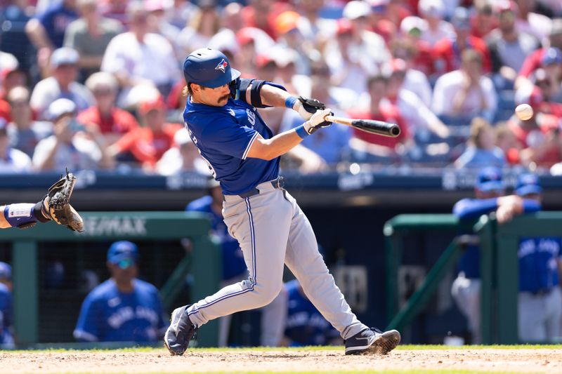 May 8, 2024; Philadelphia, Pennsylvania, USA; Toronto Blue Jays outfielder Davis Schneider (36) hits an RBI single during the sixth inning against the Philadelphia Phillies at Citizens Bank Park. Mandatory Credit: Bill Streicher-USA TODAY Sports