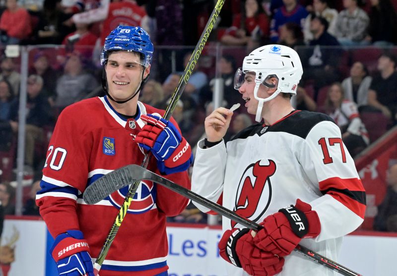 Sep 24, 2024; Montreal, Quebec, CAN; Montreal Canadiens forward Juraj Slafkovsky (20) and New Jersey Devils defenseman Simon Nemec (17) exchange words before a faceoff during the third period at the Bell Centre. Mandatory Credit: Eric Bolte-Imagn Images