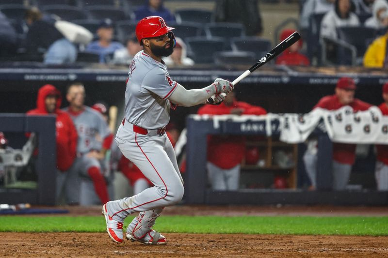 Aug 8, 2024; Bronx, New York, USA;  Los Angeles Angels right fielder Jo Adell (7) hits a three run double in the fifth inning against the New York Yankees at Yankee Stadium. Mandatory Credit: Wendell Cruz-USA TODAY Sports