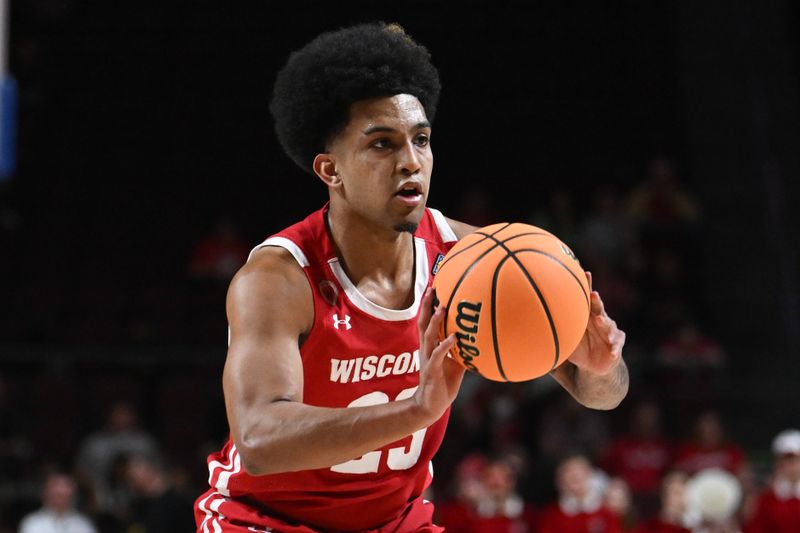 Mar 28, 2023; Las Vegas, NV, USA; Wisconsin Badgers guard Chucky Hepburn (23) passes the ball against the North Texas Mean Green in the first half at Orleans Arena. Mandatory Credit: Candice Ward-USA TODAY Sports