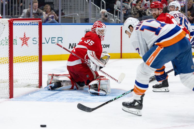 Oct 30, 2023; Elmont, New York, USA; Detroit Red Wings goaltender Ville Husso (35) tracks the puck against the New York Islanders during the second period at UBS Arena. Mandatory Credit: Thomas Salus-USA TODAY Sports