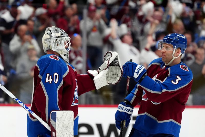 Apr 28, 2024; Denver, Colorado, USA; Colorado Avalanche goaltender Alexandar Georgiev (40) and Colorado Avalanche defenseman Jack Johnson (3) celebrate defeating the Winnipeg Jets following game four of the first round of the 2024 Stanley Cup Playoffs at Ball Arena. Mandatory Credit: Ron Chenoy-USA TODAY Sports