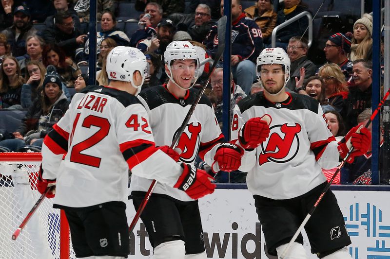 Jan 19, 2024; Columbus, Ohio, USA; New Jersey Devils right wing Nathan Bastian (14) celebrates his goal against the Columbus Blue Jackets during the second period at Nationwide Arena. Mandatory Credit: Russell LaBounty-USA TODAY Sports