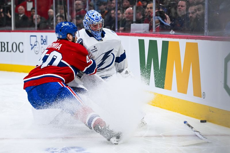 Jan 21, 2025; Montreal, Quebec, CAN; Montreal Canadiens right wing Joel Armia (40) chases the puck against Tampa Bay Lightning goalie Andrei Vasilevskiy (88) during the first period at Bell Centre. Mandatory Credit: David Kirouac-Imagn Images