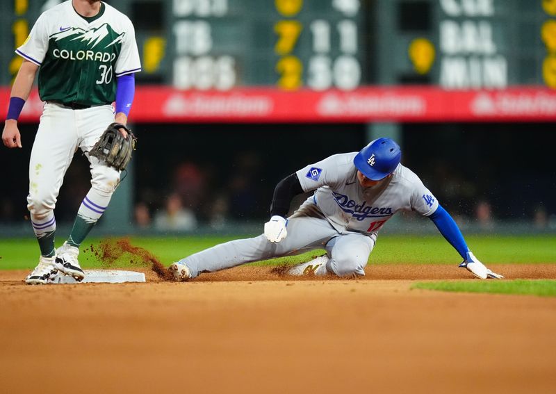 Sep 28, 2024; Denver, Colorado, USA; Los Angeles Dodgers designated hitter Shohei Ohtani (17) steals second base in the sixth inning against the Colorado Rockies at Coors Field. Mandatory Credit: Ron Chenoy-Imagn Images 