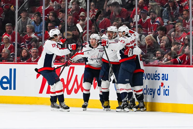 Apr 27, 2025; Montreal, Quebec, CAN; Washington Capitals left wing Andrew Mangiapane (88) celebrates with his teammates his goal against the Montreal Canadiens during the third period in game four of the first round of the 2025 Stanley Cup Playoffs at Bell Centre. Mandatory Credit: David Kirouac-Imagn Images