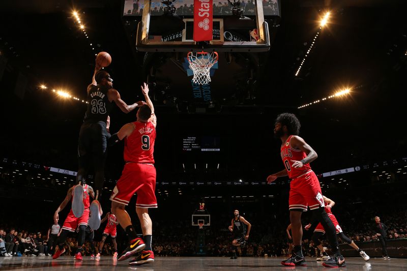 BROOKLYN, NY - MARCH 29: Nicolas Claxton #33 of the Brooklyn Nets shoots the ball during the game against the Chicago Bulls on March 29, 2024 at Barclays Center in Brooklyn, New York. NOTE TO USER: User expressly acknowledges and agrees that, by downloading and or using this Photograph, user is consenting to the terms and conditions of the Getty Images License Agreement. Mandatory Copyright Notice: Copyright 2024 NBAE (Photo by Nathaniel S. Butler/NBAE via Getty Images)