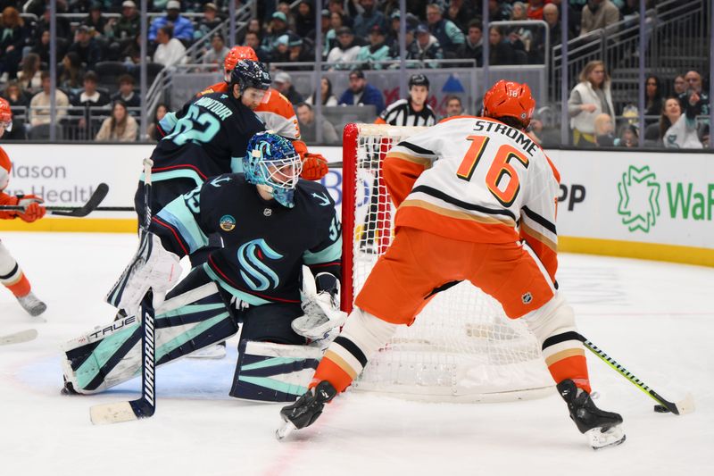 Nov 27, 2024; Seattle, Washington, USA; Seattle Kraken goaltender Joey Daccord (35) defends the goal from Anaheim Ducks center Ryan Strome (16) during the second period at Climate Pledge Arena. Mandatory Credit: Steven Bisig-Imagn Images