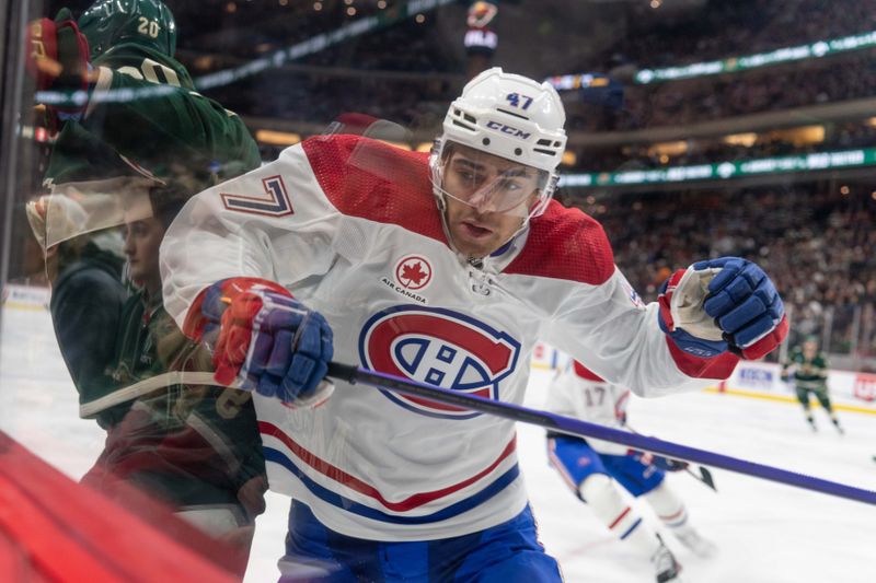 Dec 21, 2023; Saint Paul, Minnesota, USA; Montreal Canadiens defenseman Jayden Struble (47) checks Minnesota Wild left wing Pat Maroon (20) in the third period at Xcel Energy Center. Mandatory Credit: Matt Blewett-USA TODAY Sports