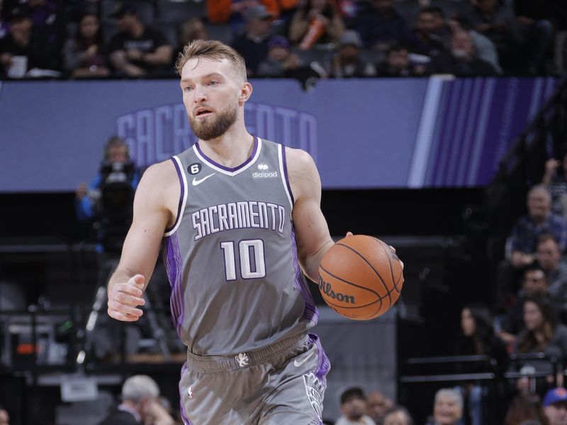 SACRAMENTO, CA - MARCH 9: Domantas Sabonis #10 of the Sacramento Kings dribbles the ball during the game against the New York Knicks on March 9, 2023 at Golden 1 Center in Sacramento, California. NOTE TO USER: User expressly acknowledges and agrees that, by downloading and or using this Photograph, user is consenting to the terms and conditions of the Getty Images License Agreement. Mandatory Copyright Notice: Copyright 2023 NBAE (Photo by Rocky Widner/NBAE via Getty Images)