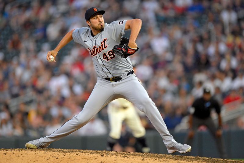 Jul 3, 2024; Minneapolis, Minnesota, USA;  Detroit Tigers relief pitcher Alex Faedo (49) delivers a pitch against the Minnesota Twins during the seventh inning at Target Field. Mandatory Credit: Nick Wosika-USA TODAY Sports