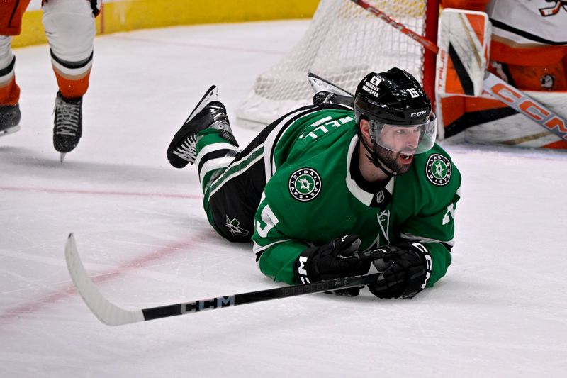 Mar 18, 2025; Dallas, Texas, USA; Dallas Stars center Colin Blackwell (15) falls to the ice during the second period against the Anaheim Ducks at the American Airlines Center. Mandatory Credit: Jerome Miron-Imagn Images