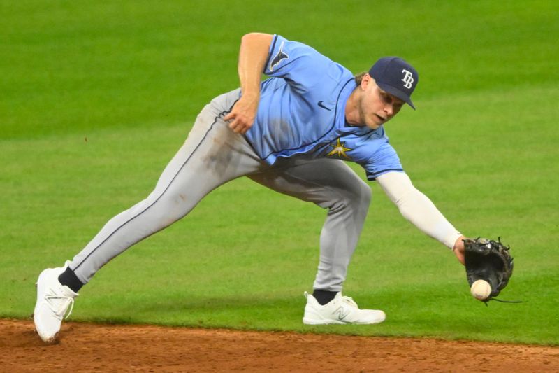 Sep 13, 2024; Cleveland, Ohio, USA; Tampa Bay Rays shortstop Taylor Walls (6) fields a ground ball in the third inning against the Cleveland Guardians at Progressive Field. Mandatory Credit: David Richard-Imagn Images