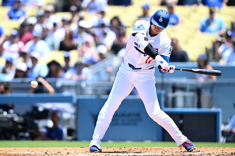 Jul 20, 2025; Los Angeles, California, USA; Los Angeles Dodgers designated hitter Shohei Ohtani (17) hits a two-run home run against the Milwaukee Brewers during the third inning of the game at Dodger Stadium. Mandatory Credit: Jonathan Hui-Imagn Images