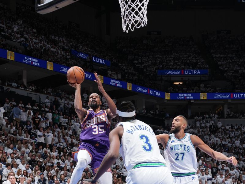 MINNEAPOLIS, MN -  APRIL 20: Kevin Durant #35 of the Phoenix Suns shoots the ball during Round One Game One of the 2024 NBA Playoffs against the Minnesota Timberwolves on April 20, 2024 at Target Center in Minneapolis, Minnesota. NOTE TO USER: User expressly acknowledges and agrees that, by downloading and or using this Photograph, user is consenting to the terms and conditions of the Getty Images License Agreement. Mandatory Copyright Notice: Copyright 2024 NBAE (Photo by Jordan Johnson/NBAE via Getty Images)