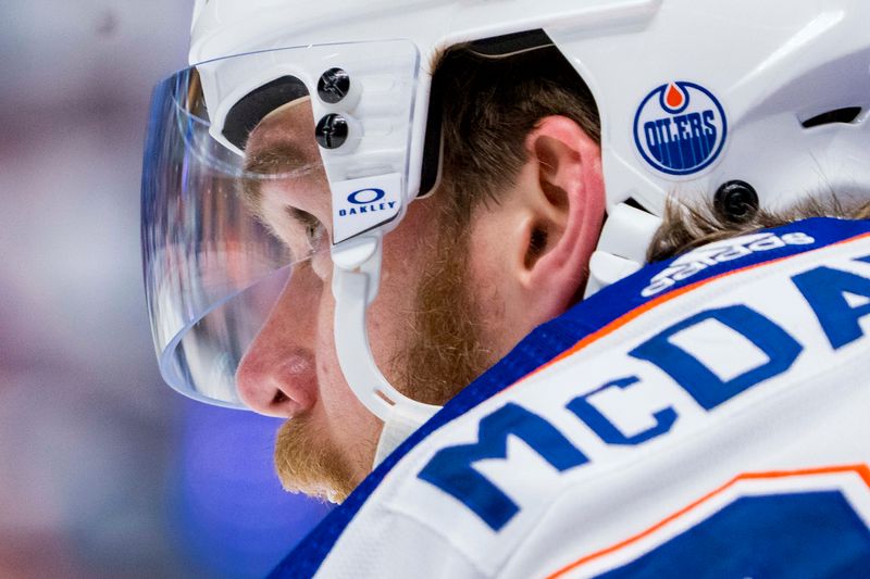 May 20, 2024; Vancouver, British Columbia, CAN; Edmonton Oilers forward Connor McDavid (97) rests in warm up prior to game seven of the second round of the 2024 Stanley Cup Playoffs against the Vancouver Canucks at Rogers Arena. Mandatory Credit: Bob Frid-USA TODAY Sports