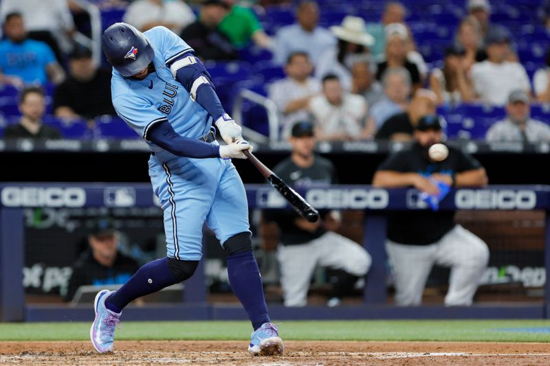 Jun 21, 2023; Miami, Florida, USA; Toronto Blue Jays right fielder George Springer (4) hits a single against the Miami Marlins during the fourth inning at loanDepot Park. Mandatory Credit: Sam Navarro-USA TODAY Sports