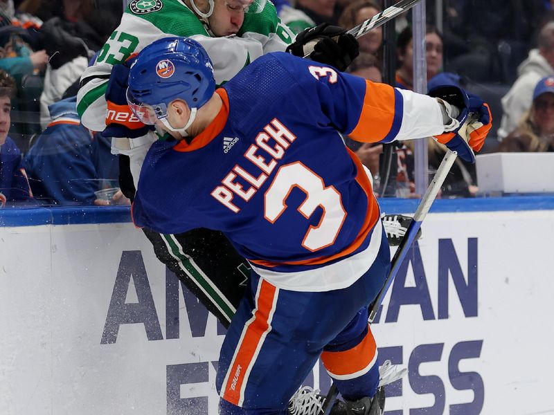 Jan 21, 2024; Elmont, New York, USA; Dallas Stars right wing Evgenii Dadonov (63) collides with New York Islanders defenseman Adam Pelech (3) as they fight for the puck during the third period at UBS Arena. Mandatory Credit: Brad Penner-USA TODAY Sports