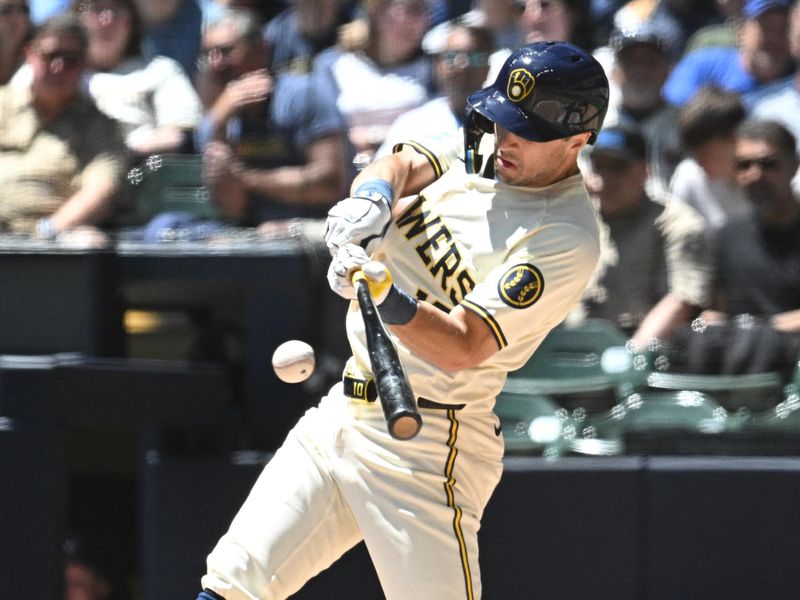 May 30, 2024; Milwaukee, Wisconsin, USA; Milwaukee Brewers outfielder Sal Frelick (10) gets a base hit against the Chicago Cubs in the second inning at American Family Field. Mandatory Credit: Michael McLoone-USA TODAY Sports