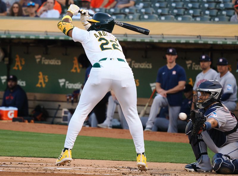 Jul 22, 2024; Oakland, California, USA; Oakland Athletics left fielder Miguel Andujar (22) avoids the pitch as it’s caught by Houston Astros catcher Yainer Diaz (21) during the first inning at Oakland-Alameda County Coliseum. Mandatory Credit: Kelley L Cox-USA TODAY Sports