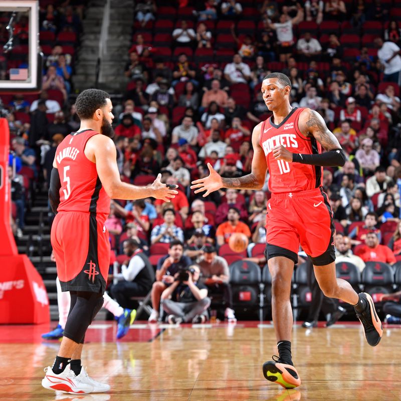 HOUSTON, TX - MARCH 6: Fred VanVleet #5 of the Houston Rockets high fives Jabari Smith Jr. #10 during the game against the LA Clippers on March 6, 2024 at the Toyota Center in Houston, Texas. NOTE TO USER: User expressly acknowledges and agrees that, by downloading and or using this photograph, User is consenting to the terms and conditions of the Getty Images License Agreement. Mandatory Copyright Notice: Copyright 2024 NBAE (Photo by Logan Riely/NBAE via Getty Images)