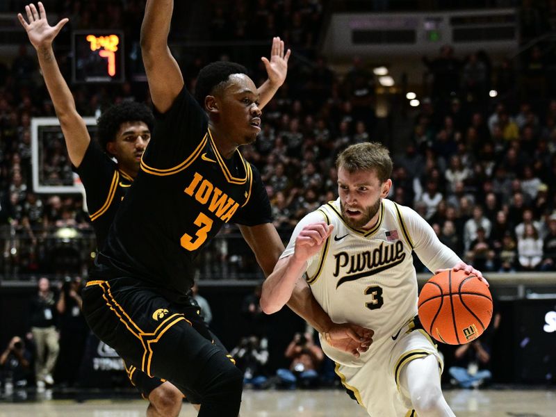 Jan 14, 2026; West Lafayette, Indiana, USA;  Purdue Boilermakers guard Braden Smith (3) drives the ball around Iowa Hawkeyes forward Cam Manyawu (3) during the second half at Mackey Arena. Mandatory Credit: Marc Lebryk-Imagn Images