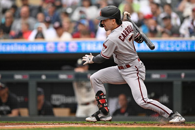 Aug 6, 2023; Minneapolis, Minnesota, USA; Arizona Diamondbacks outfielder Corbin Carroll (7) heads to first on a single against the Minnesota Twins during the third inning at Target Field. Mandatory Credit: Nick Wosika-USA TODAY Sports