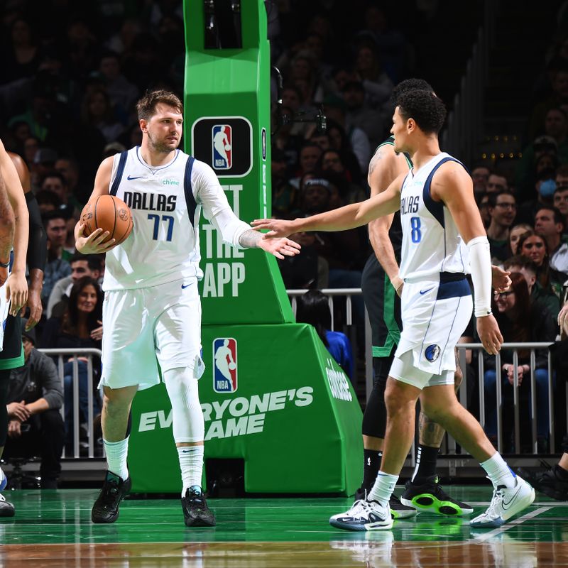BOSTON, MA - MARCH 1: Luka Doncic #77 and Josh Green #8 of the Dallas Mavericks high five during the game against the Boston Celtics on March 1, 2024 at the TD Garden in Boston, Massachusetts. NOTE TO USER: User expressly acknowledges and agrees that, by downloading and or using this photograph, User is consenting to the terms and conditions of the Getty Images License Agreement. Mandatory Copyright Notice: Copyright 2024 NBAE  (Photo by Brian Babineau/NBAE via Getty Images)