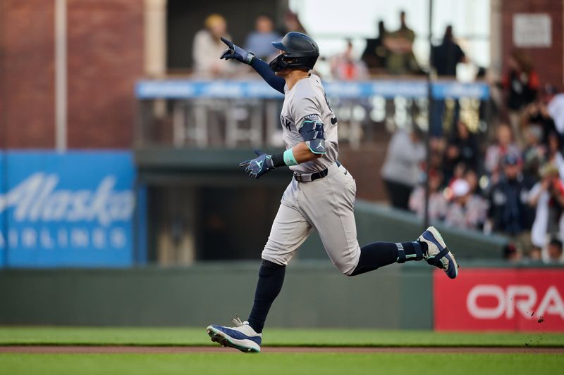 Jun 1, 2024; San Francisco, California, USA; New York Yankees outfielder Aaron Judge (99) runs the bases and gestures toward the Yankees bullpen after hitting a two-run home run against the San Francisco Giants during the first inning at Oracle Park. Mandatory Credit: Robert Edwards-USA TODAY Sports