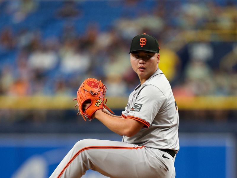 Apr 14, 2024; St. Petersburg, Florida, USA;  San Francisco Giants pitcher Kai-Wei Teng (70) throws a pitch against the Tampa Bay Rays in the seventh inning at Tropicana Field. Mandatory Credit: Nathan Ray Seebeck-USA TODAY Sports