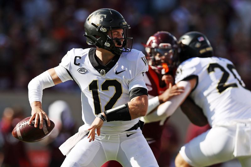 Oct 14, 2023; Blacksburg, Virginia, USA; Wake Forest Demon Deacons quarterback Mitch Griffis (12) throws a pass during the first quarter against the Virginia Tech Hokies at Lane Stadium. Mandatory Credit: Peter Casey-USA TODAY Sports