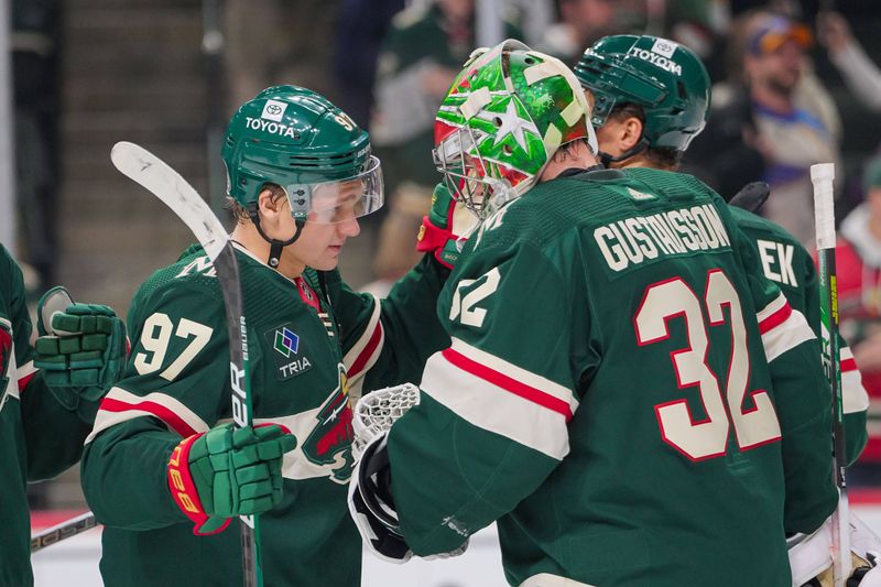 Nov 28, 2023; Saint Paul, Minnesota, USA; Minnesota Wild left wing Kirill Kaprizov (97) congratulates goaltender Filip Gustavsson (32) after the game against the St. Louis Blues in the third period at Xcel Energy Center. Mandatory Credit: Brad Rempel-USA TODAY Sports