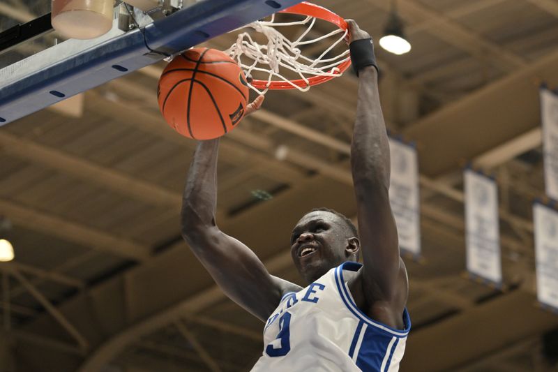 Feb 15, 2025; Durham, North Carolina, USA;  Duke Blue Devils center Khaman Maluach (9) dunks the ball during the second half against the Stanford Cardinal at Cameron Indoor Stadium. Blue Devils won 106-70. Mandatory Credit: Zachary Taft-Imagn Images