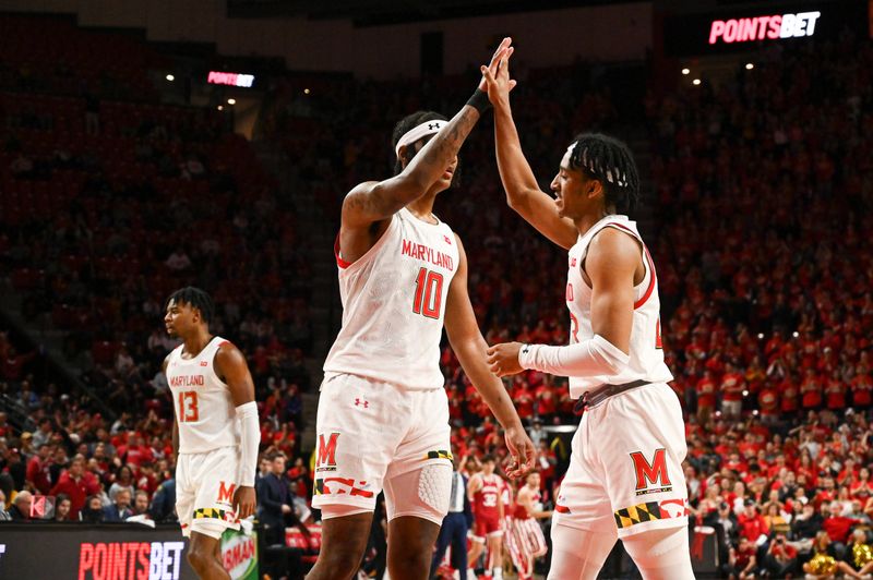 Jan 31, 2023; College Park, Maryland, USA;  Maryland Terrapins forward Julian Reese (10) high fives  guard Ian Martinez (23) during the second half against the Indiana Hoosiers at Xfinity Center. Mandatory Credit: Tommy Gilligan-USA TODAY Sports