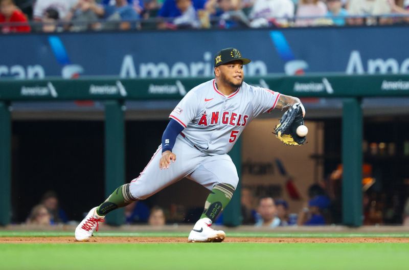 May 19, 2024; Arlington, Texas, USA; Los Angeles Angels first baseman Willie Calhoun (5) fields a ground ball during the second inning against the Texas Rangers at Globe Life Field. Mandatory Credit: Kevin Jairaj-USA TODAY Sports