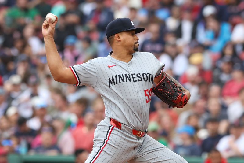 May 4, 2025; Boston, Massachusetts, USA; Minnesota Twins relief pitcher Jhoan Duran (59) delivers a pitch during the ninth inning against the Boston Red Sox at Fenway Park. Mandatory Credit: Paul Rutherford-Imagn Images