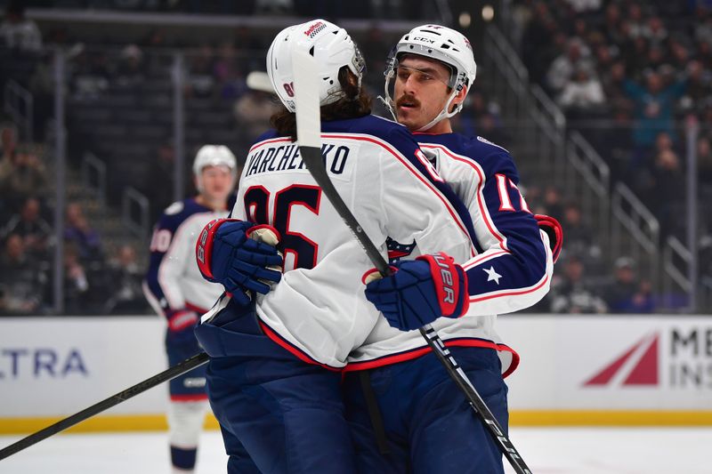 Dec 22, 2025; Los Angeles, California, USA; Columbus Blue Jackets left wing Mason Marchment (17) celebrates his goal scored against the Los Angeles Kings with right wing Kirill Marchenko (86) during the first period at Crypto.com Arena. Mandatory Credit: Gary A. Vasquez-Imagn Images