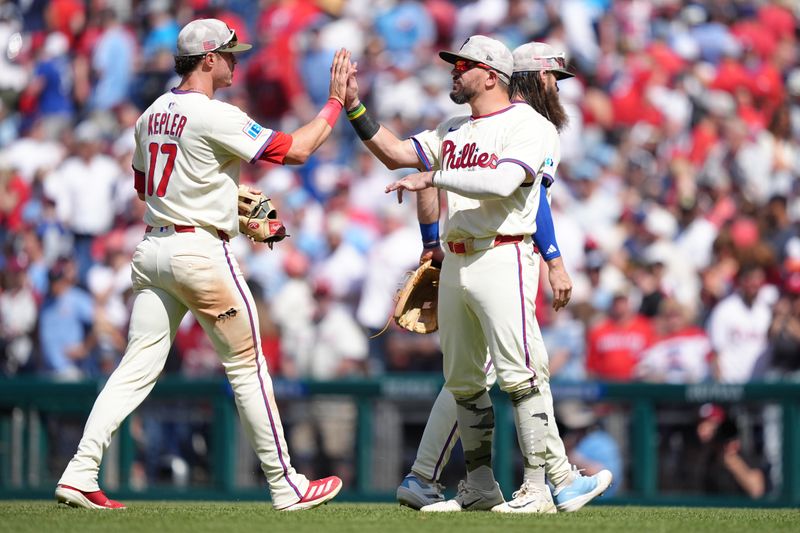 May 18, 2025; Philadelphia, Pennsylvania, USA; Philadelphia Phillies designated hitter Kyle Schwarber (12) reacts with outfielder Max Kepler (17) after the game against the Pittsburgh Pirates at Citizens Bank Park. Mandatory Credit: Kyle Ross-Imagn Images