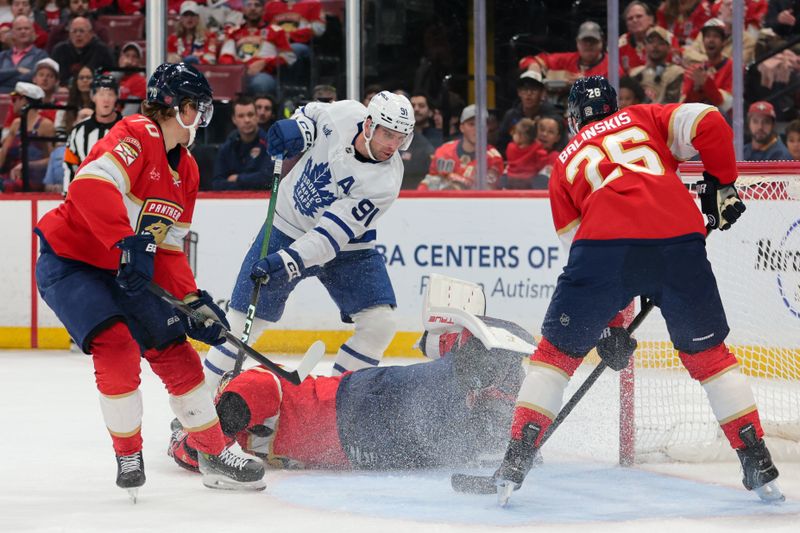 Dec 2, 2025; Sunrise, Florida, USA; Toronto Maple Leafs center John Tavares (91) shoots the puck against Florida Panthers goaltender Sergei Bobrovsky (72) during the second period at Amerant Bank Arena. Mandatory Credit: Sam Navarro-Imagn Images
