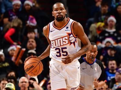 PHOENIX, AZ - DECEMBER 25: Kevin Durant #35 of the Phoenix Suns dribbles the ball during the game against the Dallas Mavericks on December 25, 2023 at Footprint Center in Phoenix, Arizona. NOTE TO USER: User expressly acknowledges and agrees that, by downloading and or using this photograph, user is consenting to the terms and conditions of the Getty Images License Agreement. Mandatory Copyright Notice: Copyright 2023 NBAE (Photo by Barry Gossage/NBAE via Getty Images)