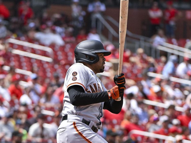 Jun 14, 2023; St. Louis, Missouri, USA;  San Francisco Giants first baseman LaMonte Wade Jr. (31) hits a one run single against the St. Louis Cardinals during the tenth inning at Busch Stadium. Mandatory Credit: Jeff Curry-USA TODAY Sports