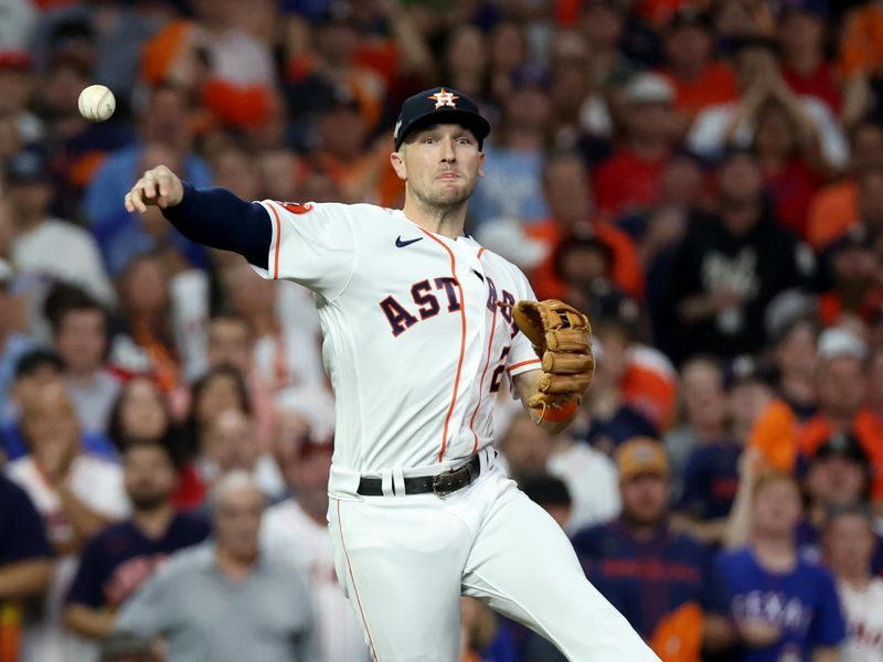 Oct 23, 2023; Houston, Texas, USA; Houston Astros third baseman Alex Bregman (2) throws to first for an out during the second inning of game seven in the ALCS against the Texas Rangers for the 2023 MLB playoffs at Minute Maid Park.  Mandatory Credit: Erik Williams-USA TODAY Sports