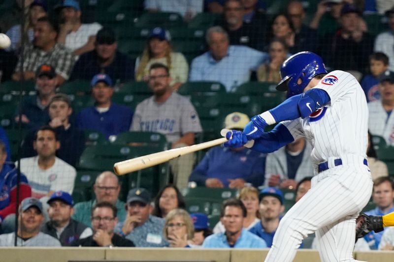 Sep 21, 2023; Chicago, Illinois, USA; Chicago Cubs second baseman Nico Hoerner (2) hits a double against the Pittsburgh Pirates during the first inning  at Wrigley Field. Mandatory Credit: David Banks-USA TODAY Sports