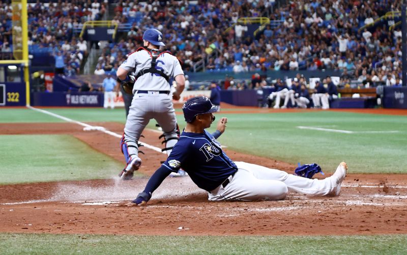 May 27, 2023; St. Petersburg, Florida, USA;  Tampa Bay Rays catcher Christian Bethancourt (14) scores a run during the fourth inning against the Los Angeles Dodgers at Tropicana Field. Mandatory Credit: Kim Klement-USA TODAY Sports