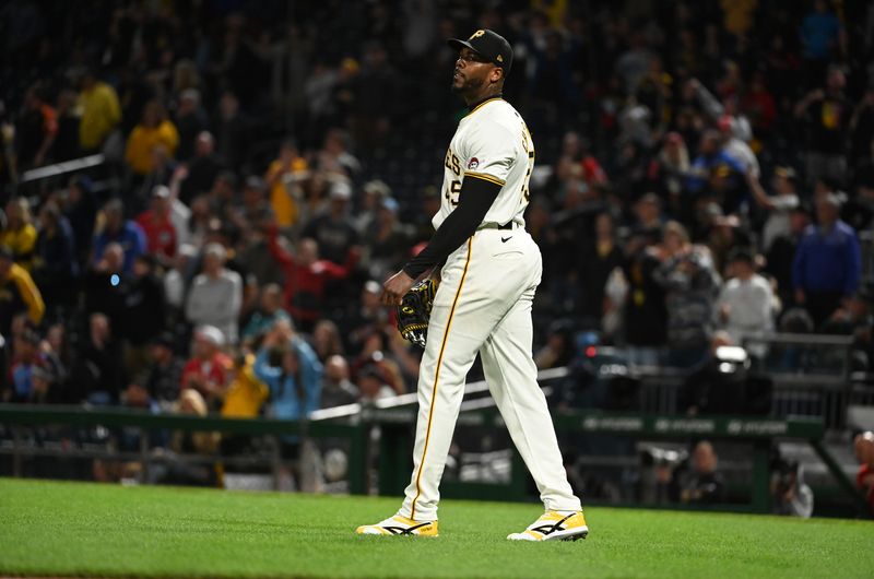 Sep 7, 2024; Pittsburgh, Pennsylvania, USA;  Pittsburgh Pirates pitcher Aroldis Chapman (45) reacts after giving up the lead to the Washington Nationals during the ninth inning of the second game of a double header at PNC Park. Mandatory Credit: Philip G. Pavely-Imagn Images